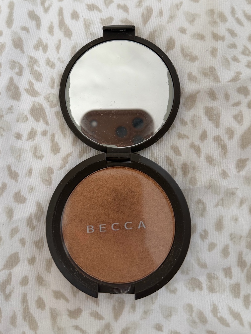 Bronzer Compact in Warm Brown Bronze. Brand: BECCA